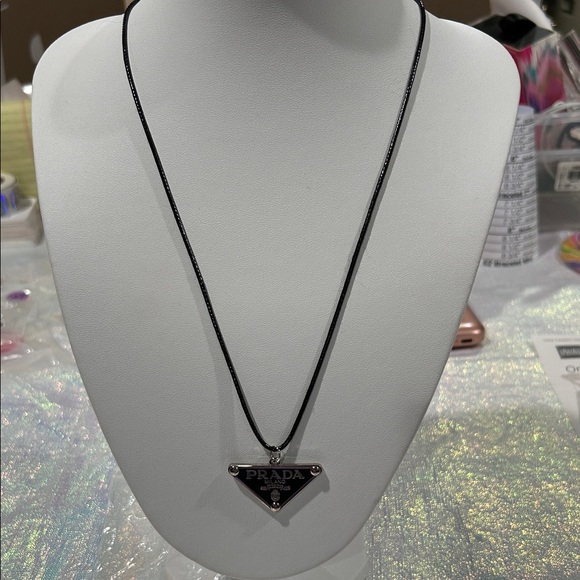 None Jewelry - 1423. Elegant PRADA zipper pull / charm on a black leather cord